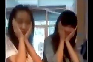 Chinese girl's skirt flipped by her friend