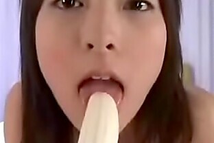 Sexy Pretty Naughty Sultry Girl sucking and licking on Hot Banana and cream all over her ! 48 sec