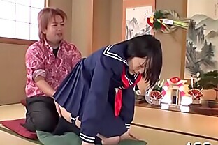 Japanese honey with butt plug enjoys rough gangbang