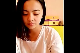 Young Asian teen showing her smooth body