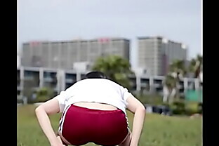 Girl in shorts playing with balloons