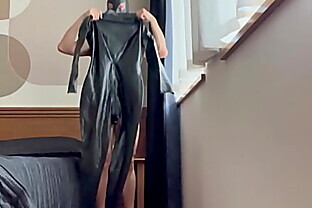 Wearing a "The Latex Collection" catsuit