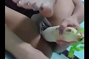 Asian June uses huge radish for her pussy