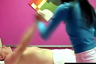 Asian masseur gives a sexy rub down