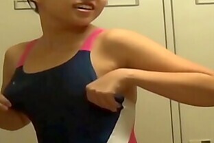 Asians in locker room change into swimsuits