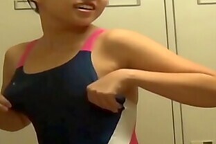 Asians in locker room change into swimsuits