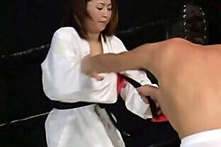 Masked slave is by a powerful mistress in the ring