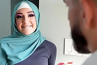 Young muslim girl trained by her soccer coach