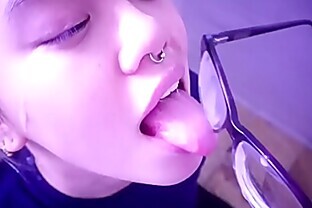 An Asian Slut Waits For Her Master; She Licks The Cum Off Her Glasses. Full Video On