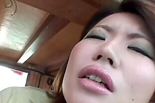 Asian babe on a fishing boat tries out the sex toy